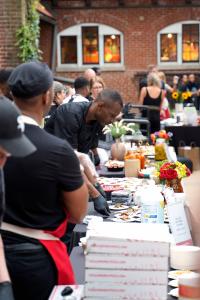 Chefs preparing dishes at the National Museum of Puerto Rican Arts & Culture, the location of Chicago Chefs Cook for Puerto Rico on September 28, 2022