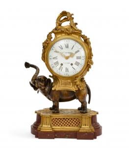 Mid-18th century Louis XV style gilt and patinated bronze and rouge royale marble elephant form mantel clock by Charles du Tertre of Paris, the dial signed and the twin train movement striking on a bell, 23 ½ inches tall (est. $3,000-$5,000).