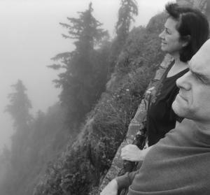 Two artists look out over a natural outlook in Oregon; in misty black and white.