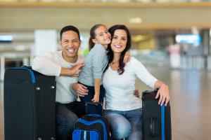 Family traveling with luggage