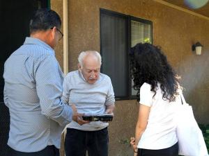 Delivering turkey dinners door-to-door to Rosewood Senior Apartments residents