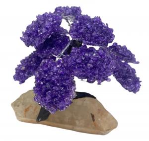 Large, 15-branch amethyst clustered gemstone tree on clear quartz with a faux tree trunk, from the amethysts of Uruguay, 75 millimeters tall (est. $250-$500).