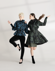 Models wear the signature monarch rain jackets in teal and olivine.