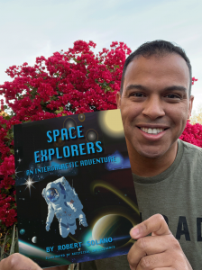 Image of author Robert Solano holding a book he wrote, published, and illustrated in less than 8 hours using artificial intelligence