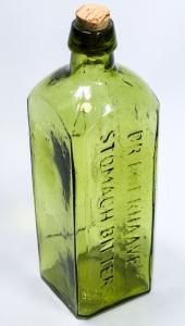 Circa 1868 Dr. Boerhaave’s Stomach Bitters bottle, dark green lime with an applied top, 8 ¾ inches tall, a very rare Western bitters bottle, one of a handful known ($8,435).