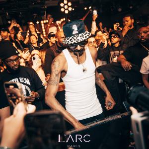 DJ Snoopadelic (Snoop Dogg) performing for the crowd in Paris