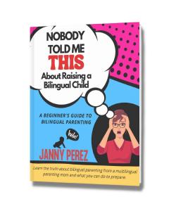 An image of a book cover featuring a title in bold letters and a colorful graphic illustration of a woman with the thought bubble Nobody Told Me This About Raising a Bilingual Child. The book cover also includes the name of the author, Janny Perez and sup