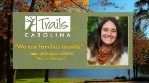 Screenshot of a Trails Carolina YouTube video titled "We Reunite Families at Trails." The image shows a picture of primary therapist, Amanda Mojave, smiling.