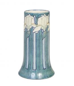 Newcomb College high glaze iris vase by Maria de Hoa Leblanc, 1908, just over 9 inches tall, of tapered form, with artist’s initials and Newcomb cypher to the underside (est. $6,000-$9,000)