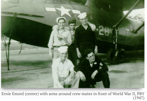 Ernie Emord (center) with arms around crew mates in front of World War II, PBY (1947)