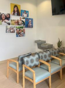 Interior view of the new dental office reception area in Murrieta, CA. The space is brightly lit, with comfortable seating for patient's comfort.