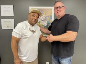 Gregg Sharp and Curtis Elerson producers shaking hands
