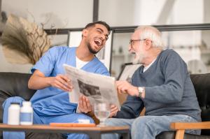 Caregiver and client laughing