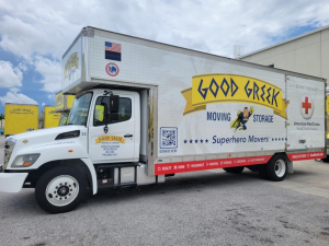 Good Greek wrapped moving trucks with American Red Cross logos and donation details