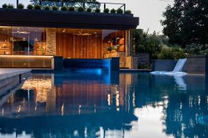 reflection of the cabana in the infinity edge pool