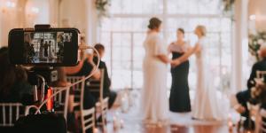 Happy Couple Celebrating their vows with Wedfuly live streaming camera for virtual guests
