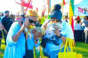 jerk festival women eating corn