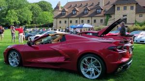 A Chevrolet Corvette C8 is shown in front of the Larz Anderson Auto Museum for Corvette Day 2023