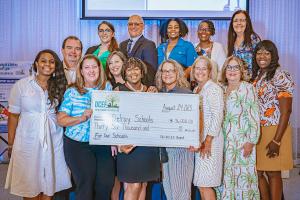 DCEF Presents Check at Annual DCEF Education Breakfast