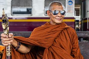 monk in shades at bangkok station