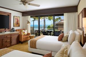 A chic Ko'a Kea day use room with ocean view, modern decor, and inviting tropical ambiance.