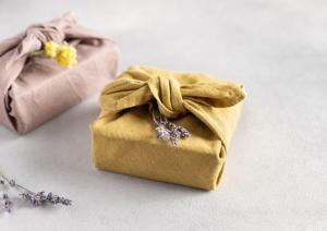A box wrapped in linen as an example of how to use reusable materials.
