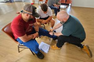 Remote first aid course Brisbane students learning snake bite bandage