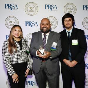 The team at ChavezPR, Ximena Acosta, Stephen Chavez and Joseph Chavez, receive an award for their work on the series “Tacos y Tequila” for Alexandra Lozano.