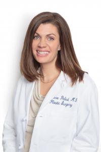 Headshot photo of Dr. Anne Peled Smiling in Physician Lab Coat