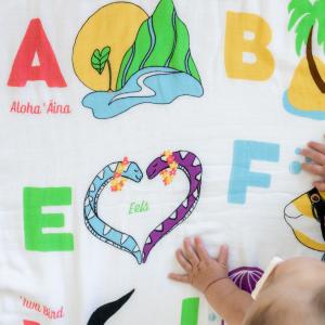 Hawaiʻi Kine ABCs Muslin Baby Quilt featuring all 26 letters of the English alphabet. Each letter is associated with a unique feature of Hawaiʻi.