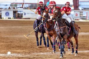 trinity women's polo players ride horses alongside texas tech,four female players