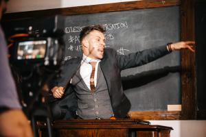 Dylan Galvin teaching with intensity for the music video "How to Write a Pop Song"