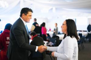 Presidential candidate Ryan Binkley speaks a Republican woman in Iowa.