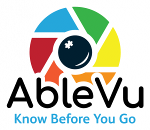 The image is a logo with the text "Know Before You Go" written in black font. The logo graphic consists of a colorful gauge or meter with four segments in blue, red, green, and yellow, each representing a different level, in a clockwise direction. At the