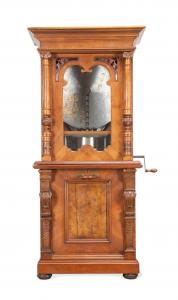 Circa 1890 German coin-op music-box (or polyphon), likely made by Paul Ehrlich, having a Renaissance Revival upright walnut and burl veneer case in two pieces ($8,470).