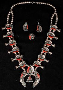 Vintage Navajo squash blossom set consisting of the squash blossom, earrings and ring, the squash blossom showcasing both turquoise and branch coral together. (est. $2,800-$3,200).