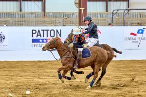 two arena polo players on horses during Texas Arena League play