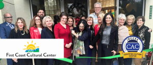 First Coast Cultural Center team celebrating ribbon cutting at new location. Shows CAC badge and center logo