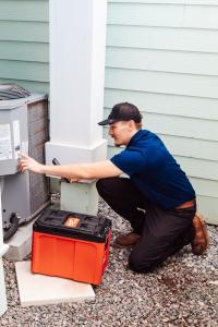 Mold Inspection Being Conducted with Technician Inspecting AC Compressor in Ponte Vedra Beach Florida