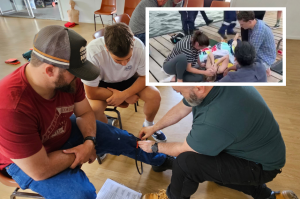 Students learn tourniquet techniques in remote first aid course in Brisbane.