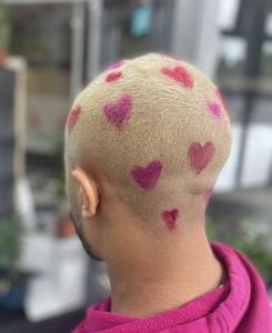Client dyed hair for Valentines Day in bleach blonde and red and pink hearts