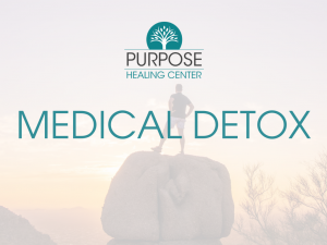 A man atop a boulder shows the concept of effective medical detox for recovery at Purpose Healing Center