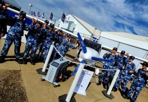 Australian Air Force Cadets standing with the Pipistrel Electro Aircraft