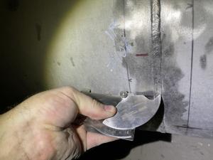 A photo of an AWSCWI.COM pipeline welding inspector using a Bridge Cam Gauge, fully engaged in the inspection process, underscores the company's commitment to excellence in ensuring pipeline safety and durability.