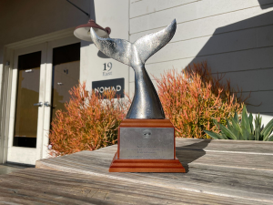 Award with metal whale tail near front door showing the name "Nomad".