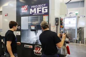 A team producing their machined piece for the competition.