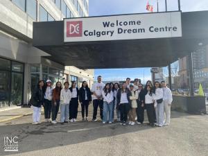 INCGiving youth volunteers in front of the Calgary Dream Centre located at 4510 Macleod Trail SW. Calgary, AB.