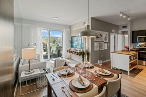 Select units offer kitchen islands, laminate kitchen flooring, stainless steel appliances, and spacious balconies.