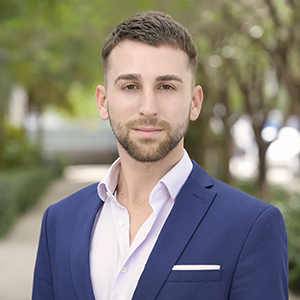 Headshot of Ryan Waugaman, Miami based realtor focused on Crypto-baced real estate solutions.