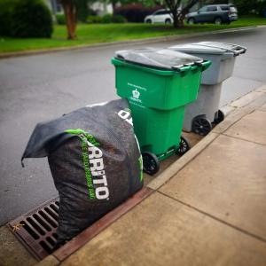 Leaf Burrito® The Year Round Yard Bag sit neatly at the curb for emptying while allowing rain to drain through it and preventing debris from entering the storm drain.